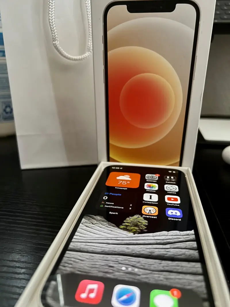 iPhone 12 in its box.