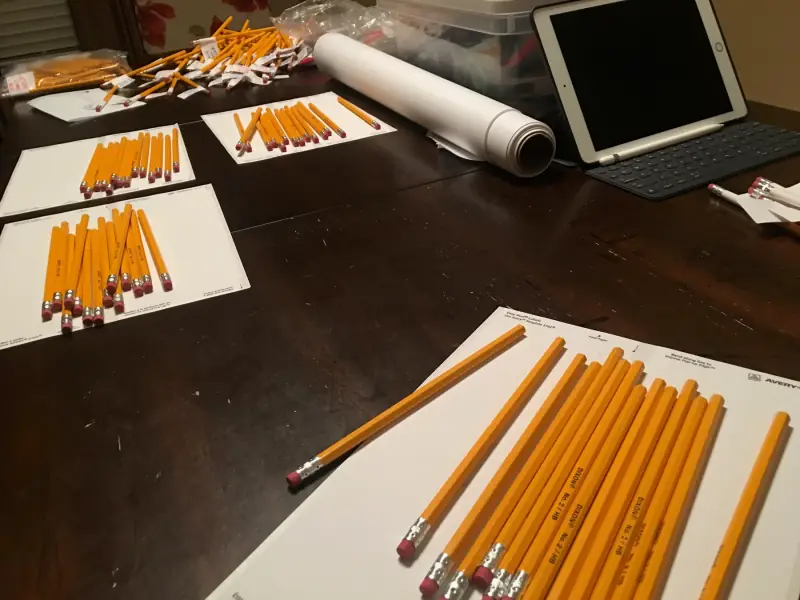 Campaign materials being assembled on a table.