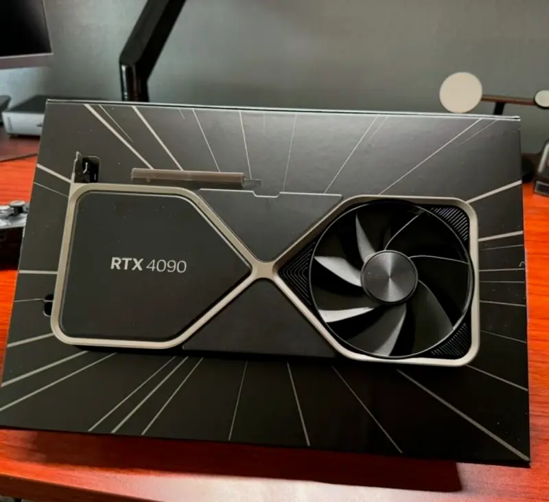 RTX 4090 graphics card beside its box.