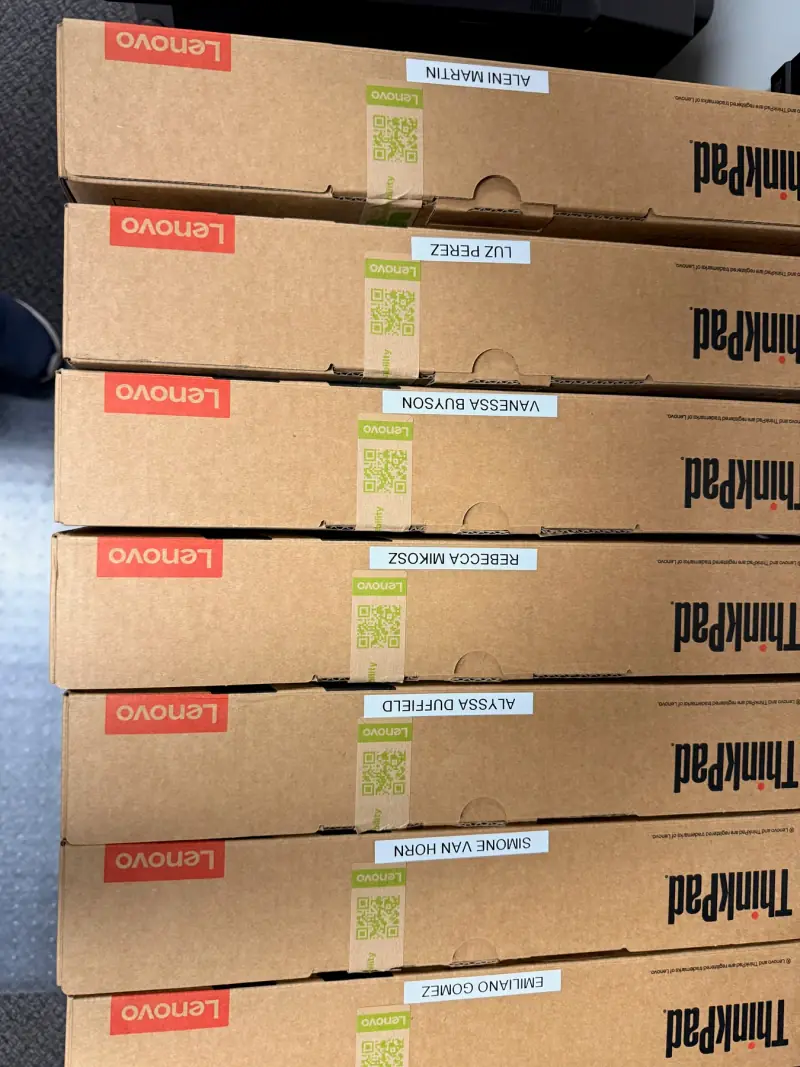 ThinkPads stacked for provisioning.
