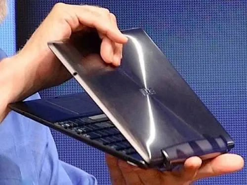 The tablet being detached from its keyboard dock.
